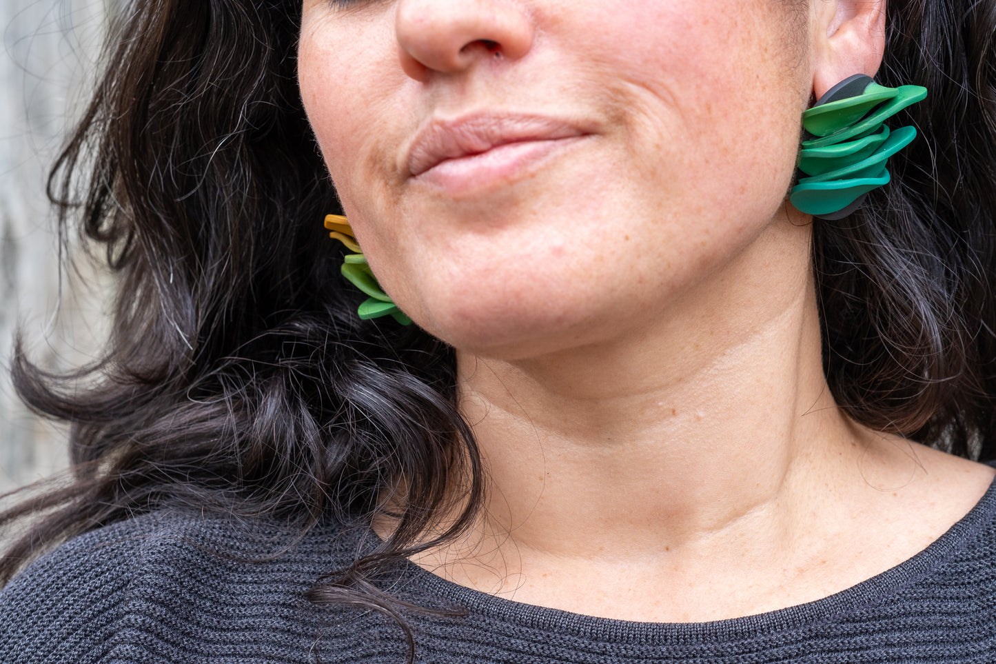 Asymmetrical green petals studs