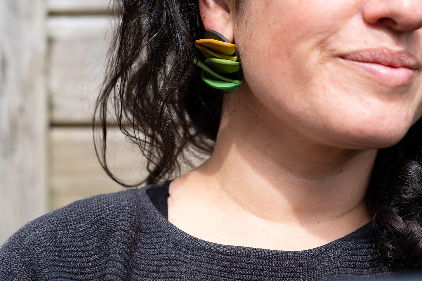 Asymmetrical green petals studs