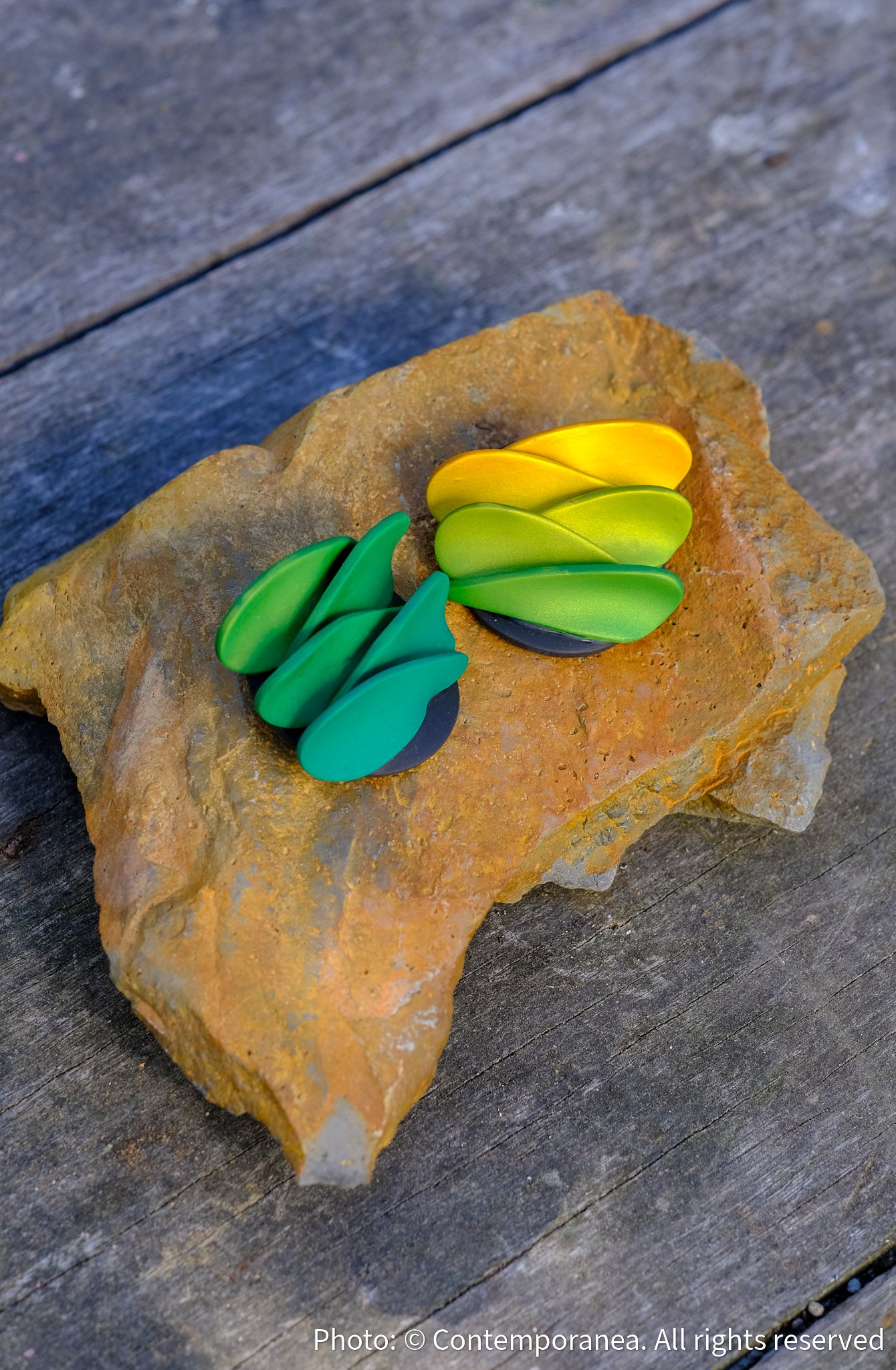 Asymmetrical green petals studs