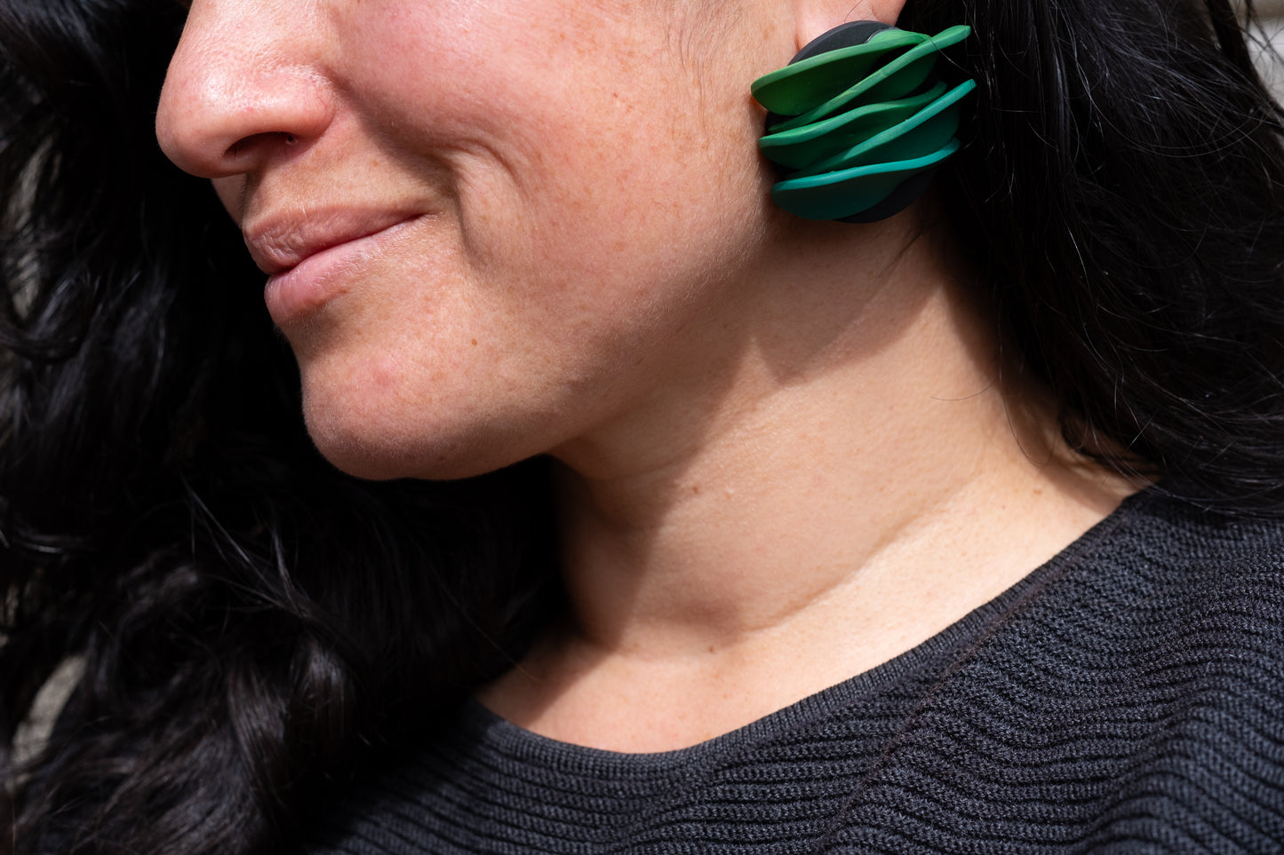 Asymmetrical green petals studs