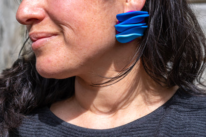 Asymmetrical blue petals studs