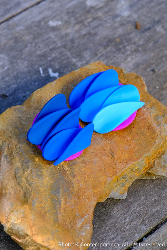 Asymmetrical blue petals studs