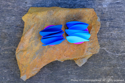 Asymmetrical blue petals studs